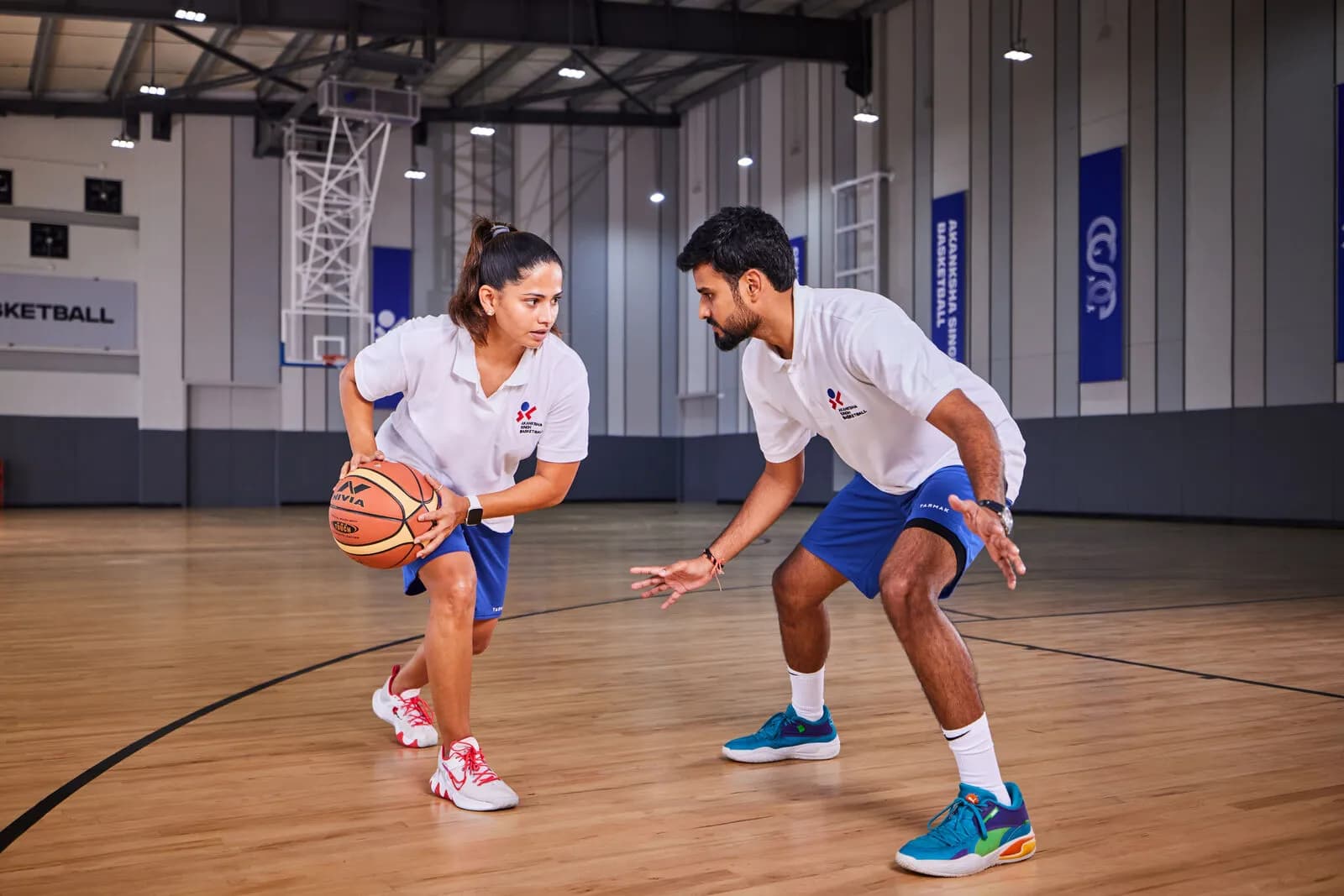 Coach Akanksha Singh leading a basketball session